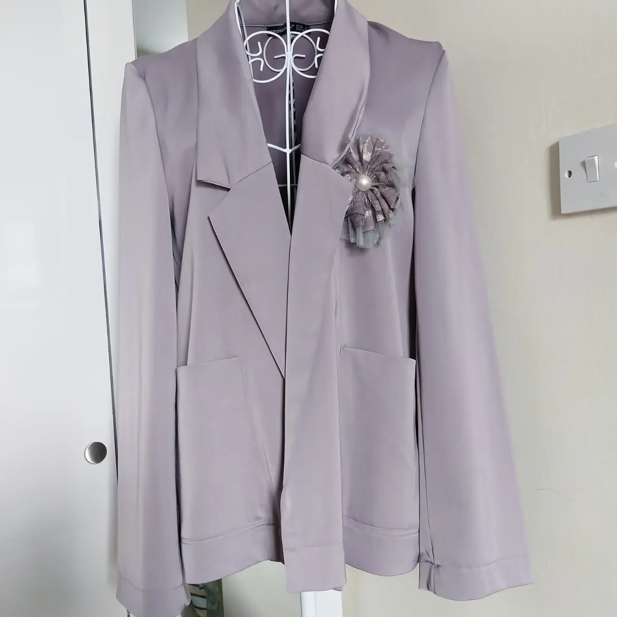 Lightweight jacket with fancy removable brooch