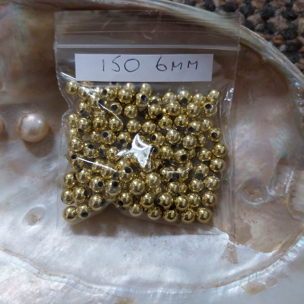 Approx 150 x 6mm gold coloured round beads