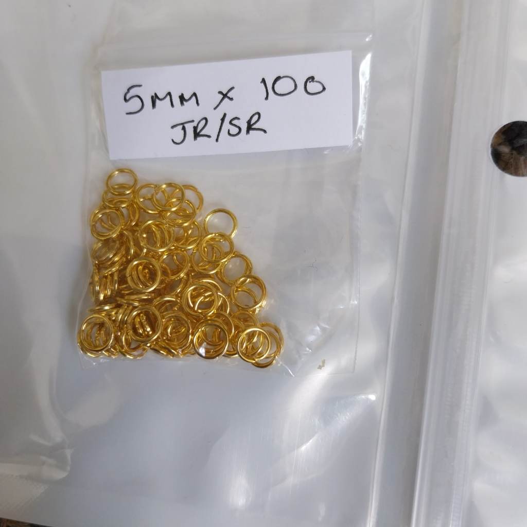 Approx 100 x 5mm jump rings gold coloured