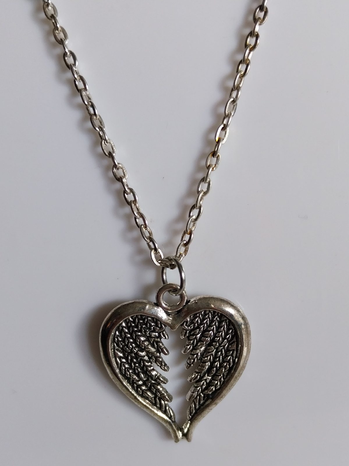 Silver coloured wings pendant  necklace