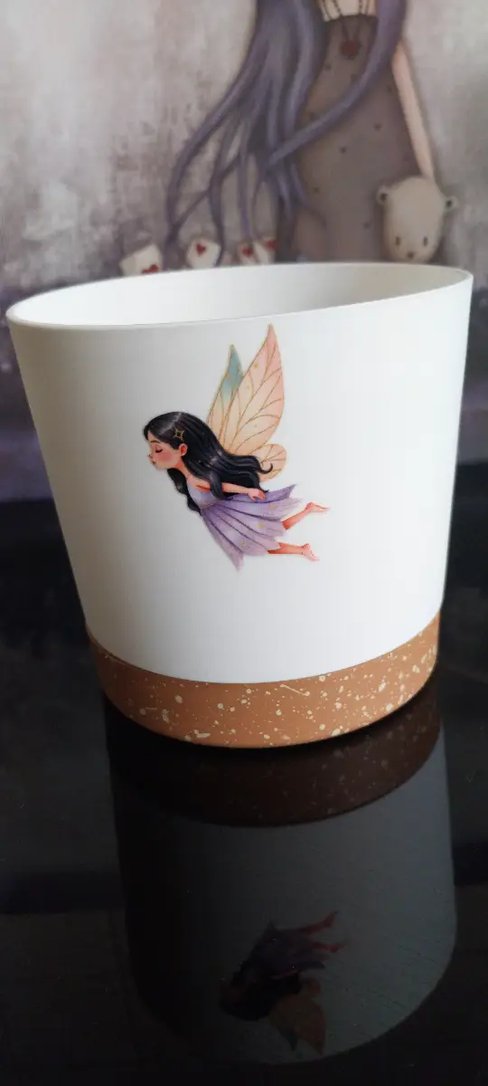 Plant pot white and terracotta coloured with whimsical design
