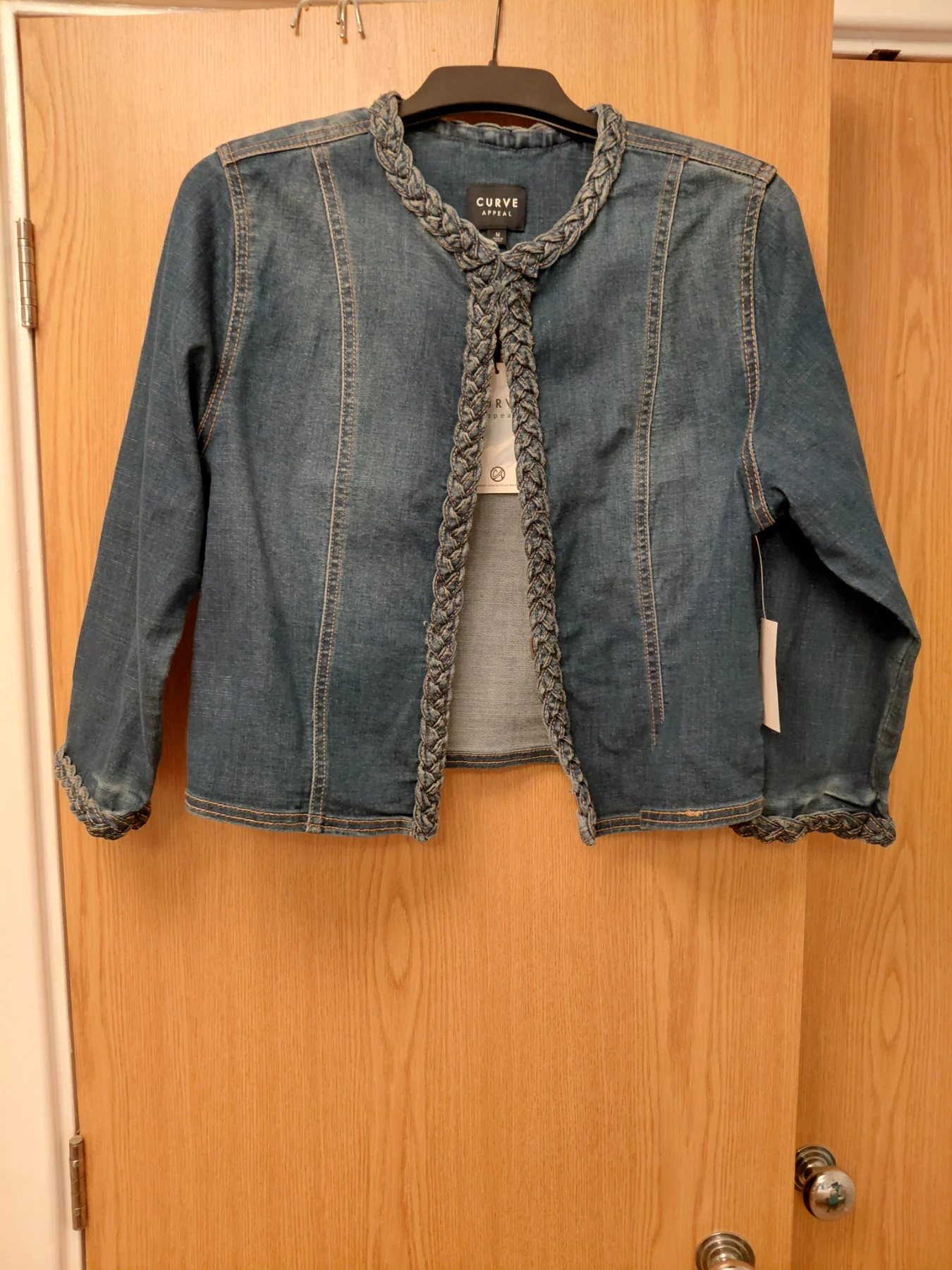 New with tags single hidden fastening denim jacket with platter detail.
