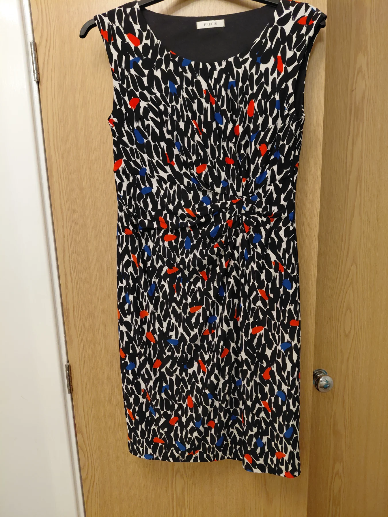 Precie dress fully lined stretch material ..dress goes to the knee.