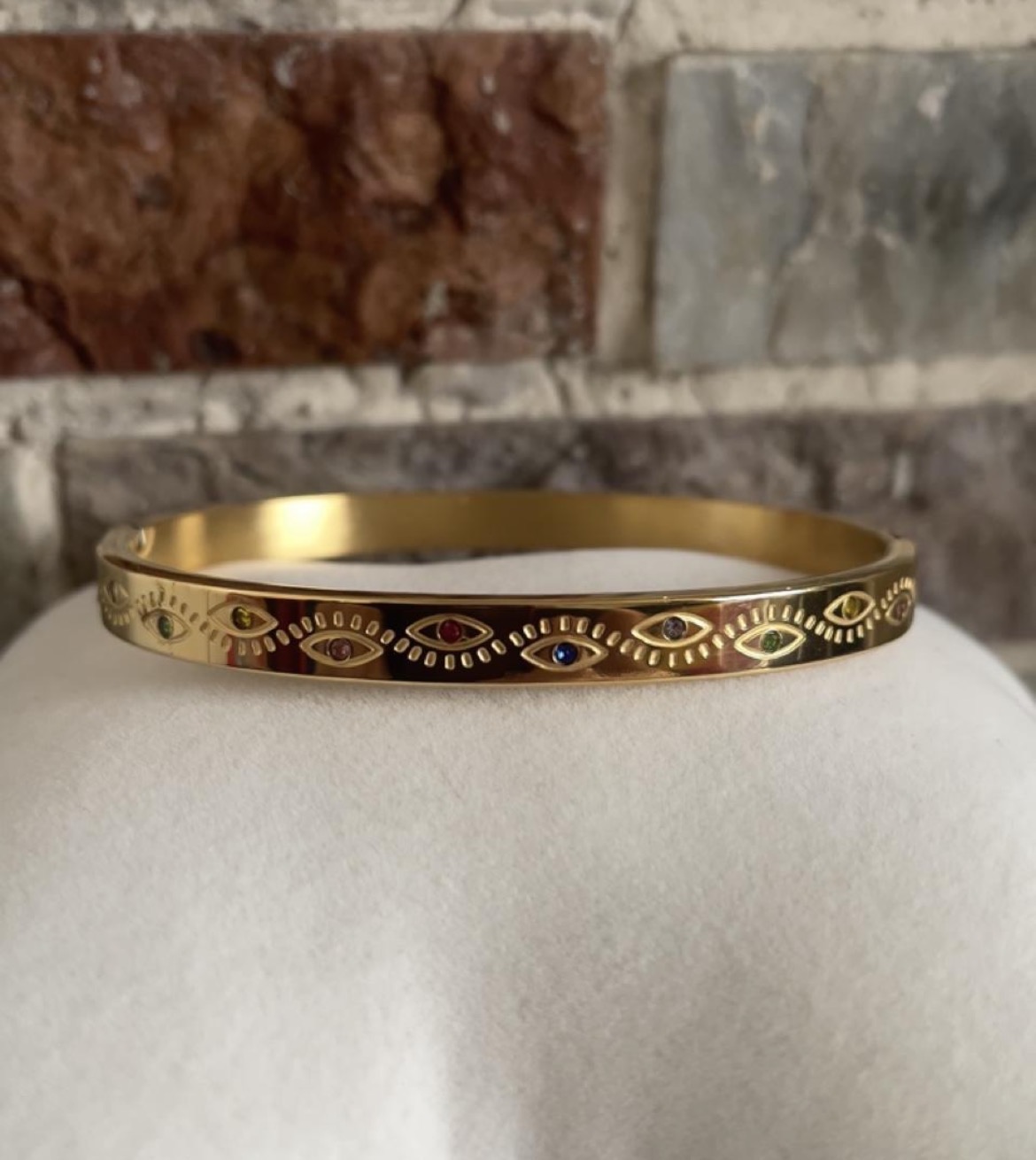 Gold bangle bracelet with eye motifs and gemstones Non tarnish
