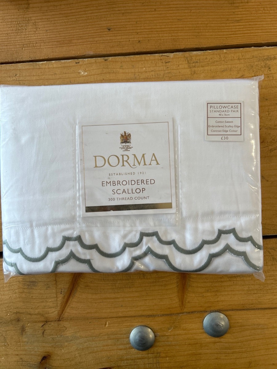 Dorma White pillowcases hundred percent Cotton green embroidered edged