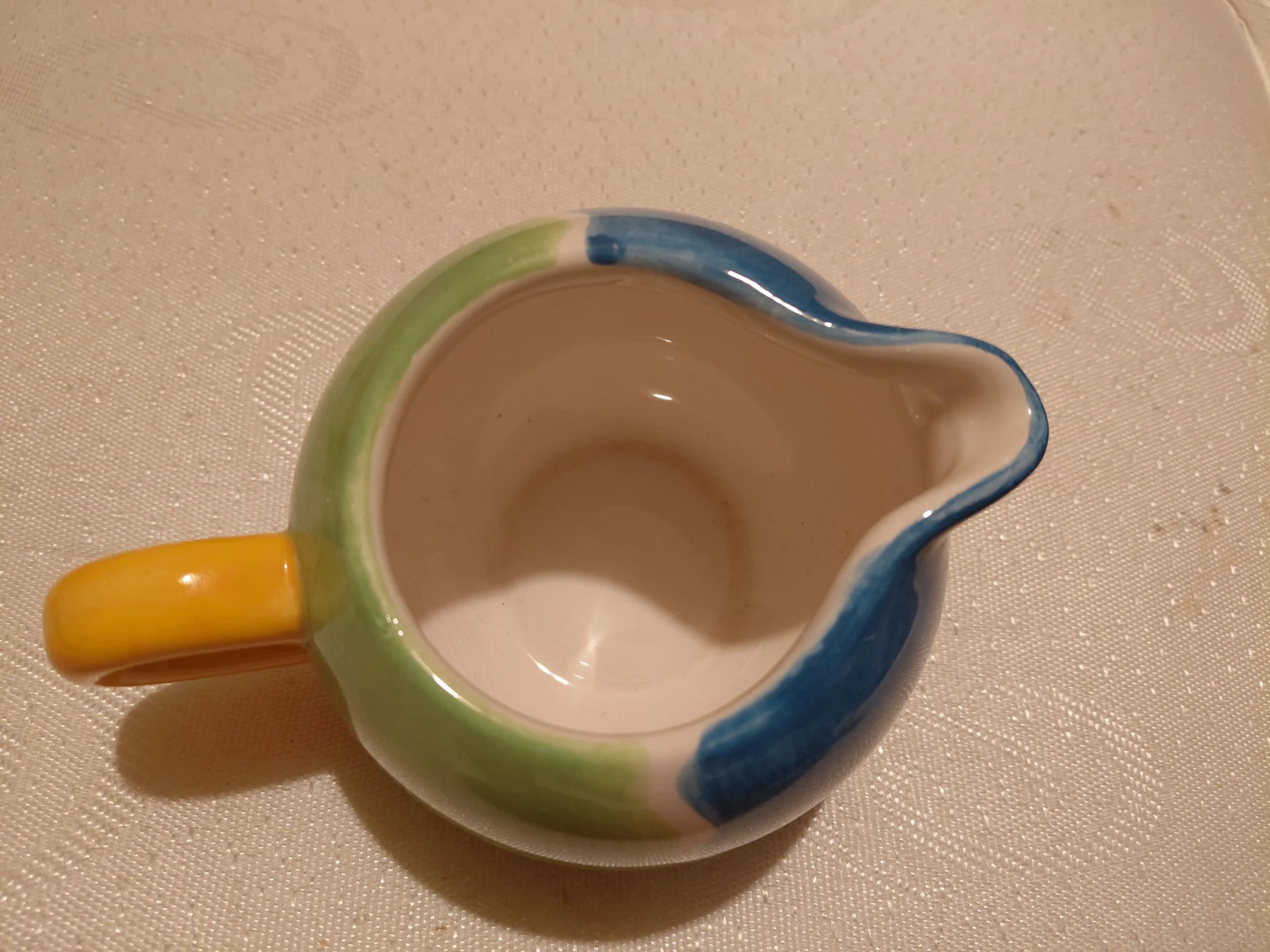 Small colourful milk jug