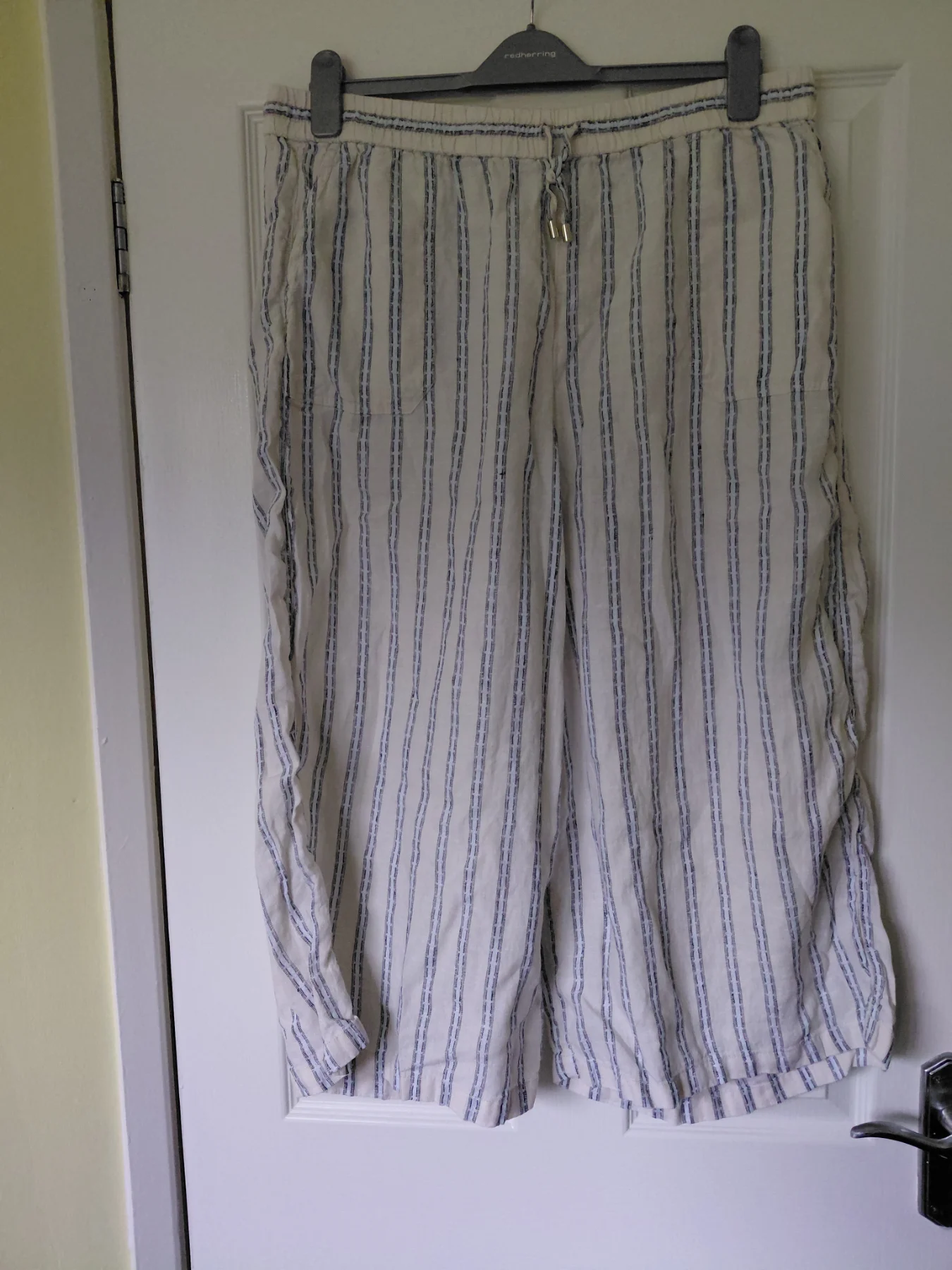 Marks and spencer cream striped  cropped trousers.