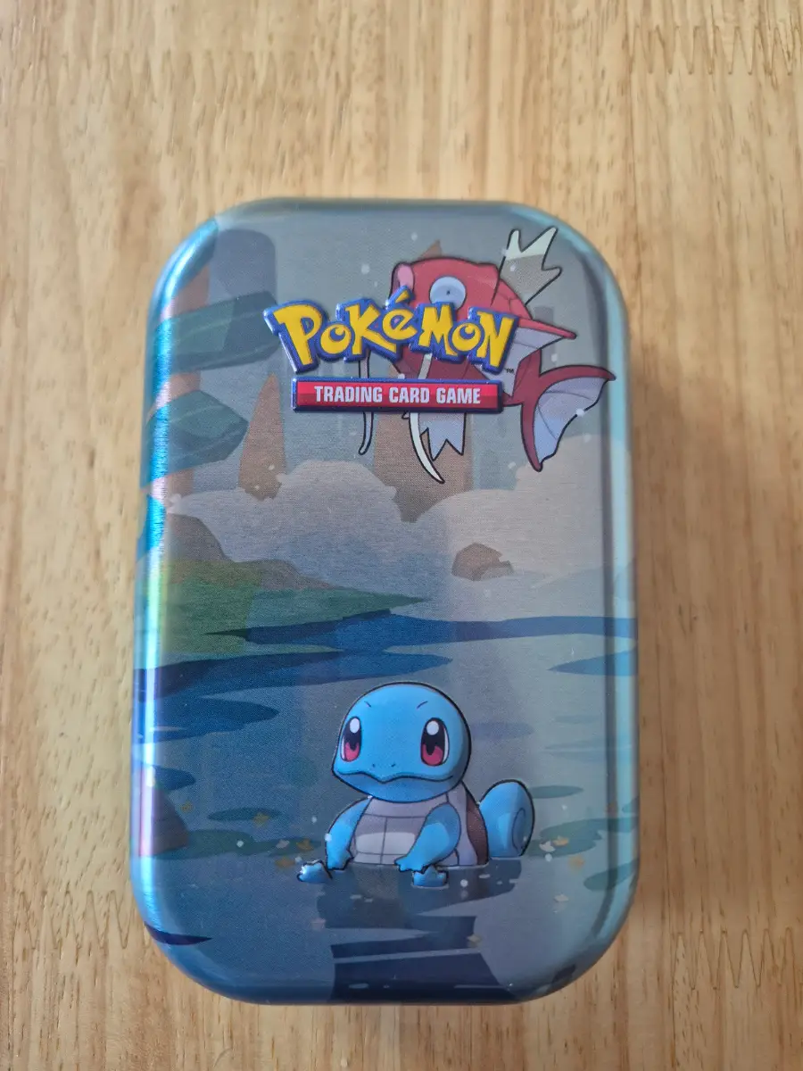 50 Pokémon cards plus 1 EX/V or better mini tin
