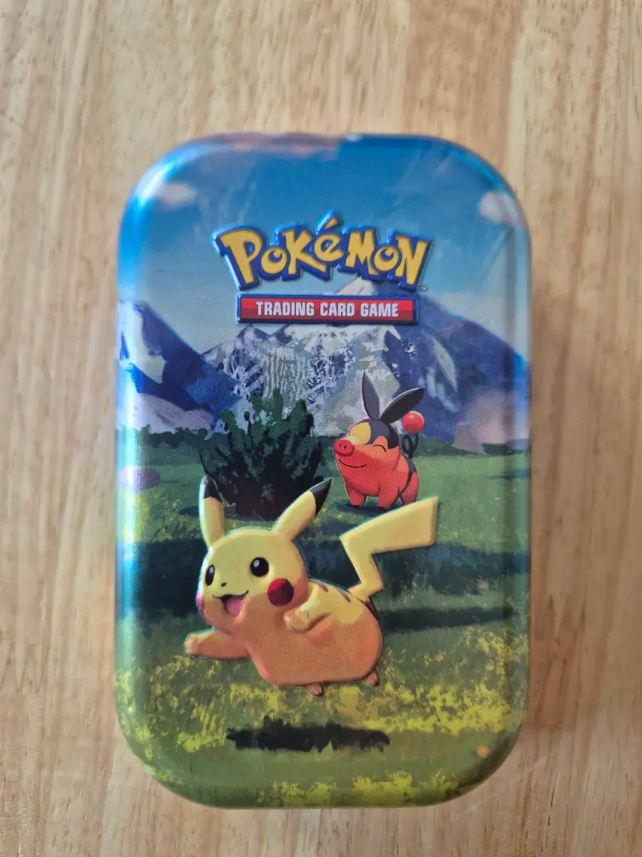 Pokémon card mini tin with EX/V card or better