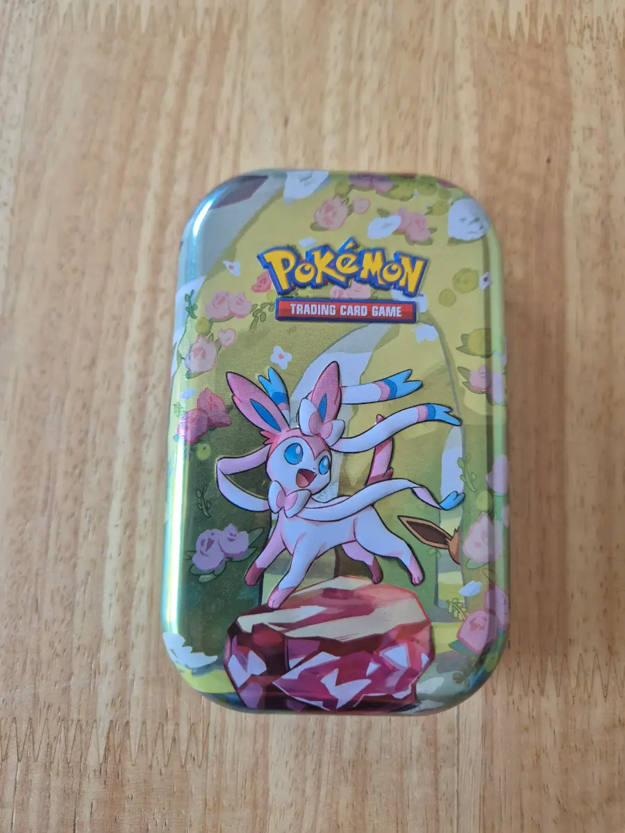 Pokémon cards with tin and EX/V card or better