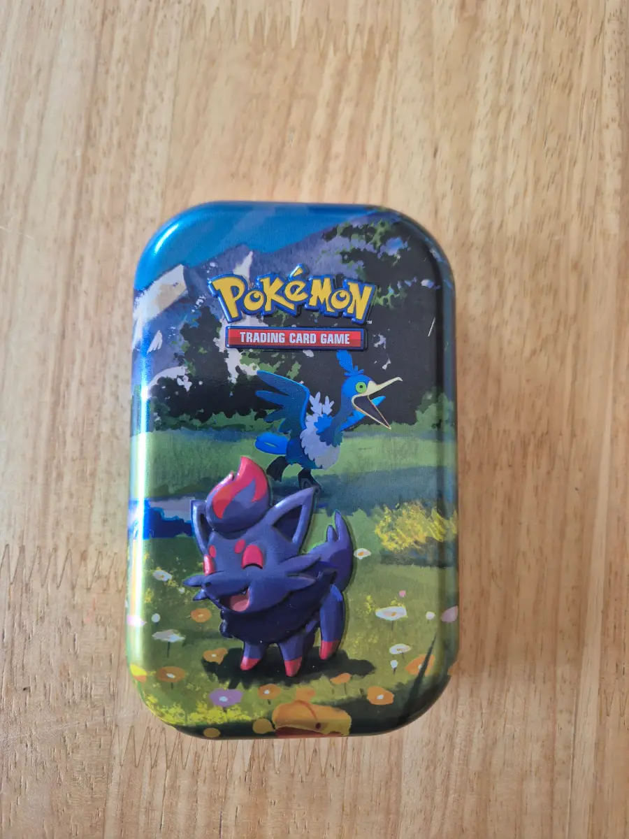 Pokémon card tin with 50 cards and 1 EX/V card or better