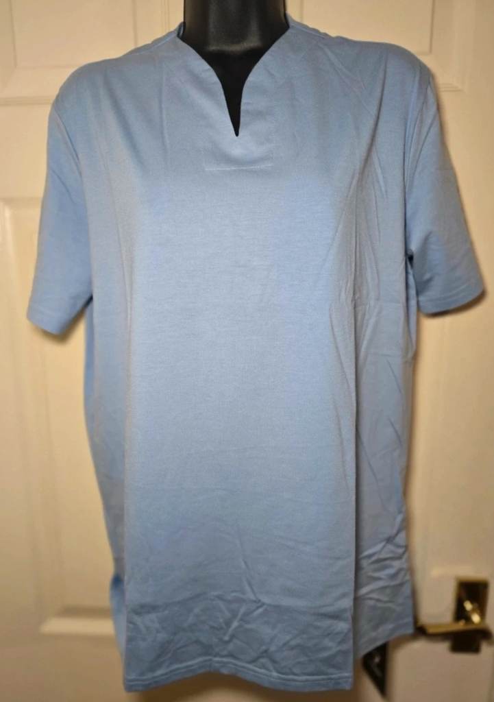 New with tags. v-neck t-shirt. light blue. Size S