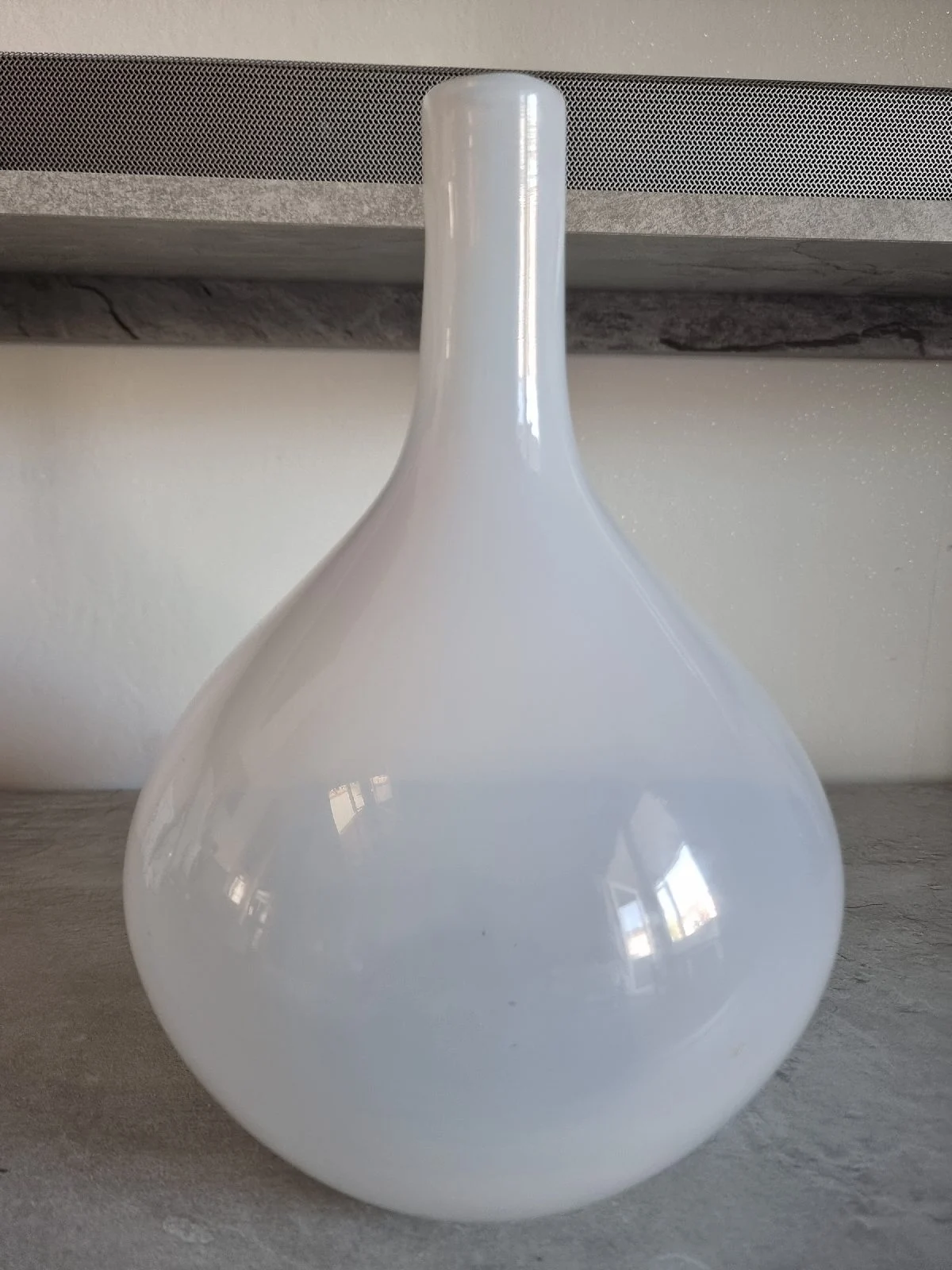 White opaque milk glass teardrop bulbous stem vase.