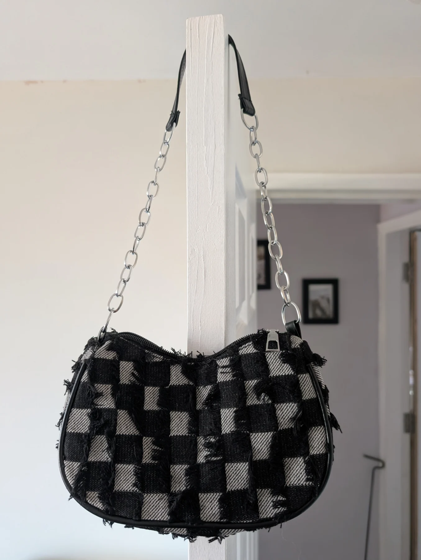 Small black and grey checkerboard distressed look bag