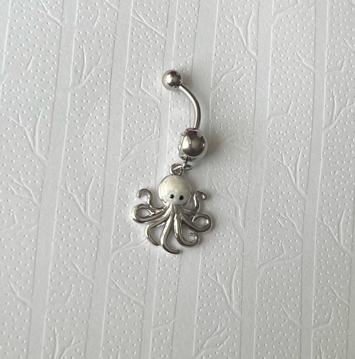 Silver tone silver gem dangly octopus belly bar