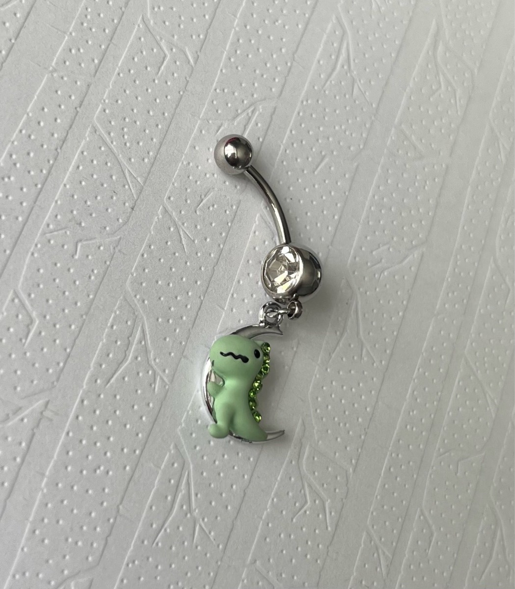 Silver gem dinosaur moon dangly belly bar