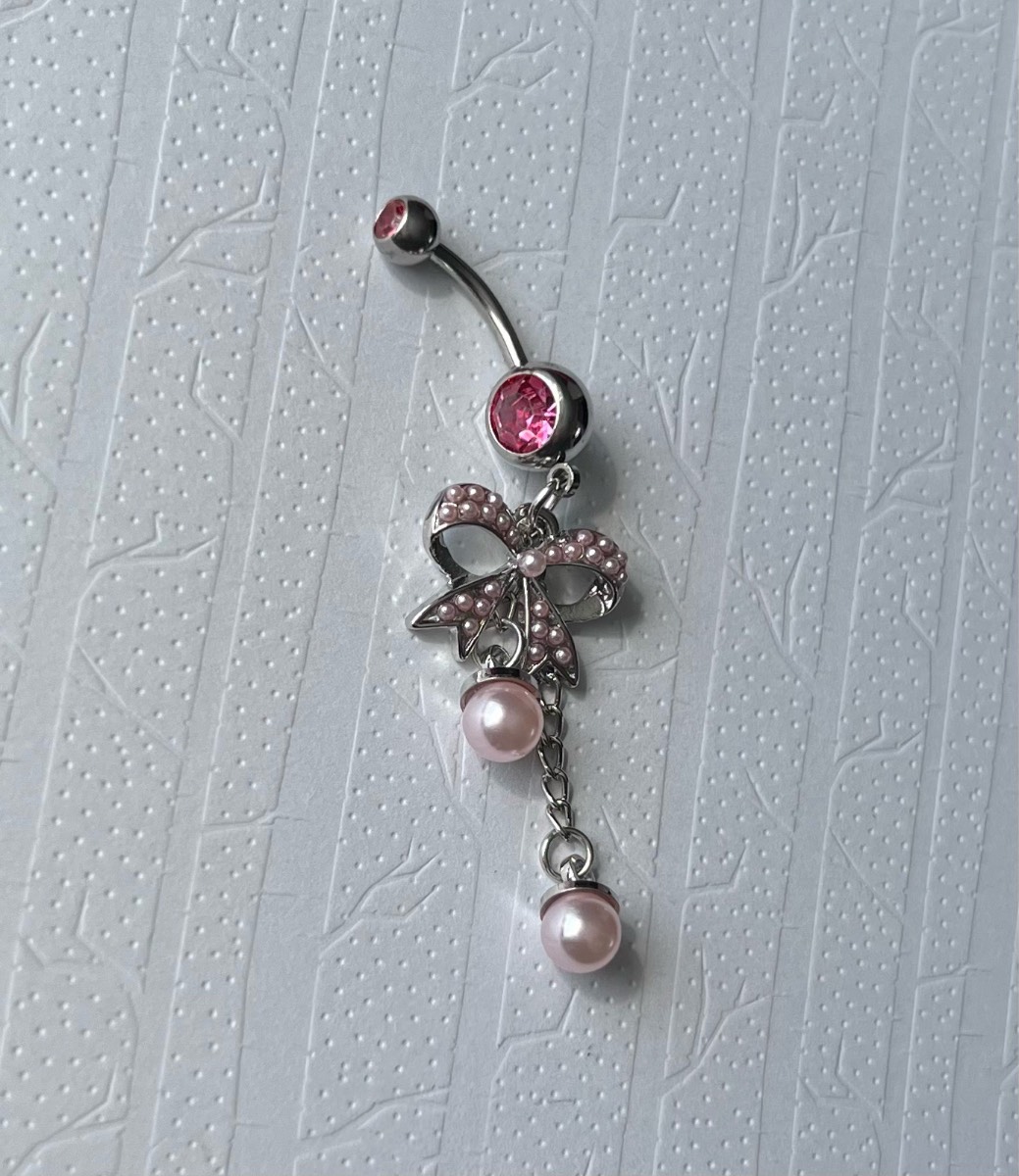 Stainless steel pink bow dangly belly bar