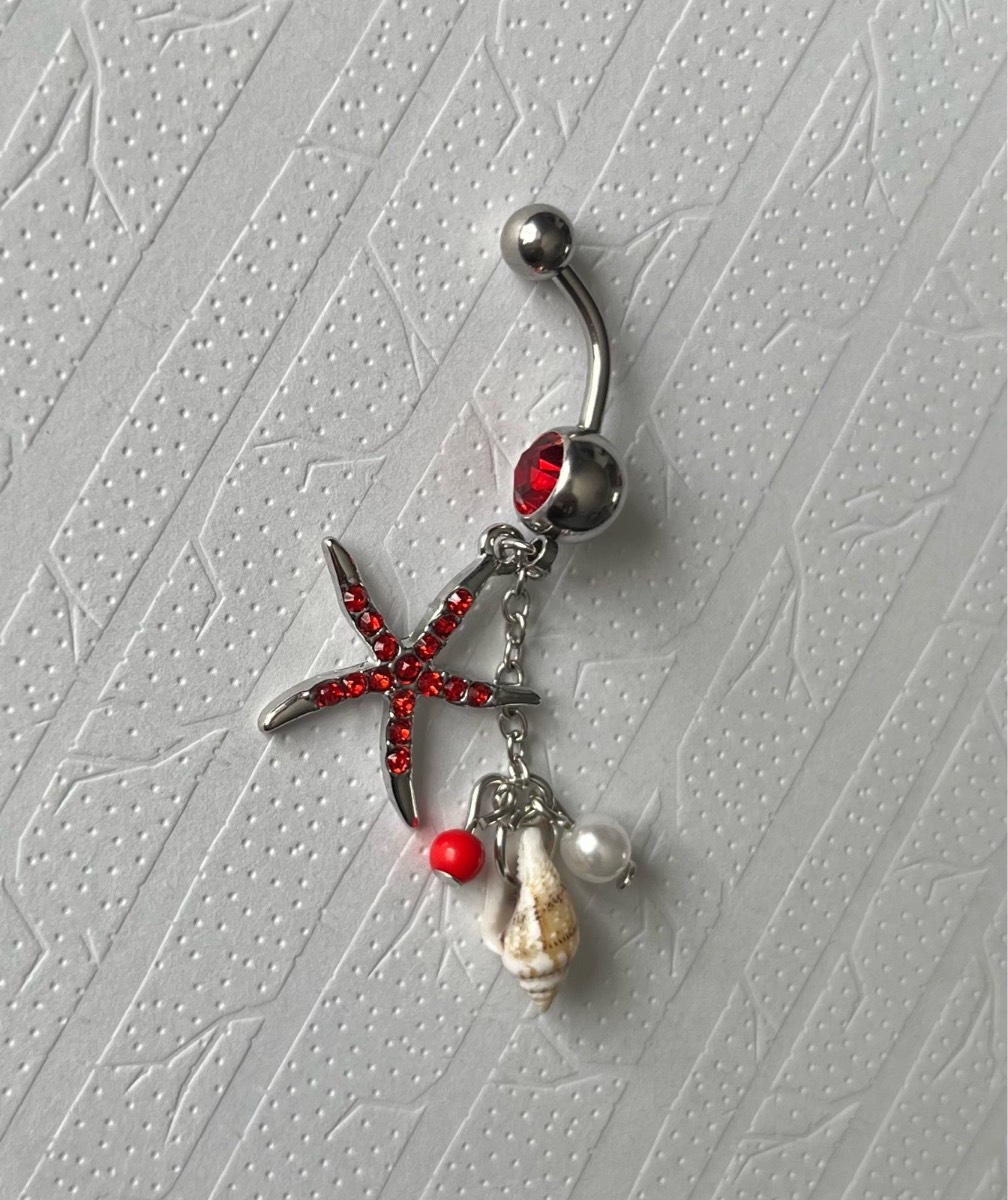 Stainless steel red gem starfish dangly belly bar