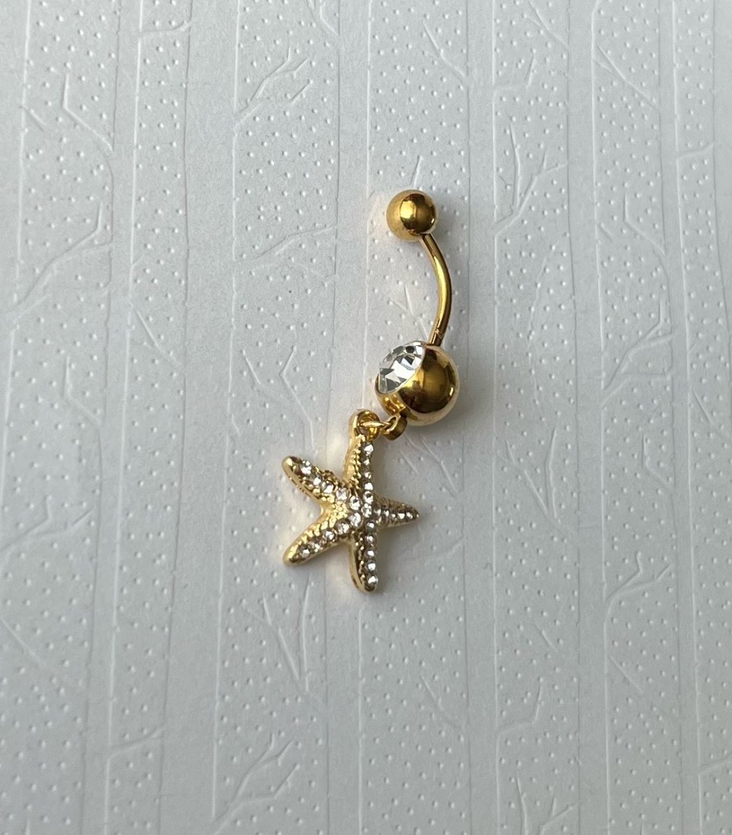 Gold tone silver gem starfish dangly belly bar