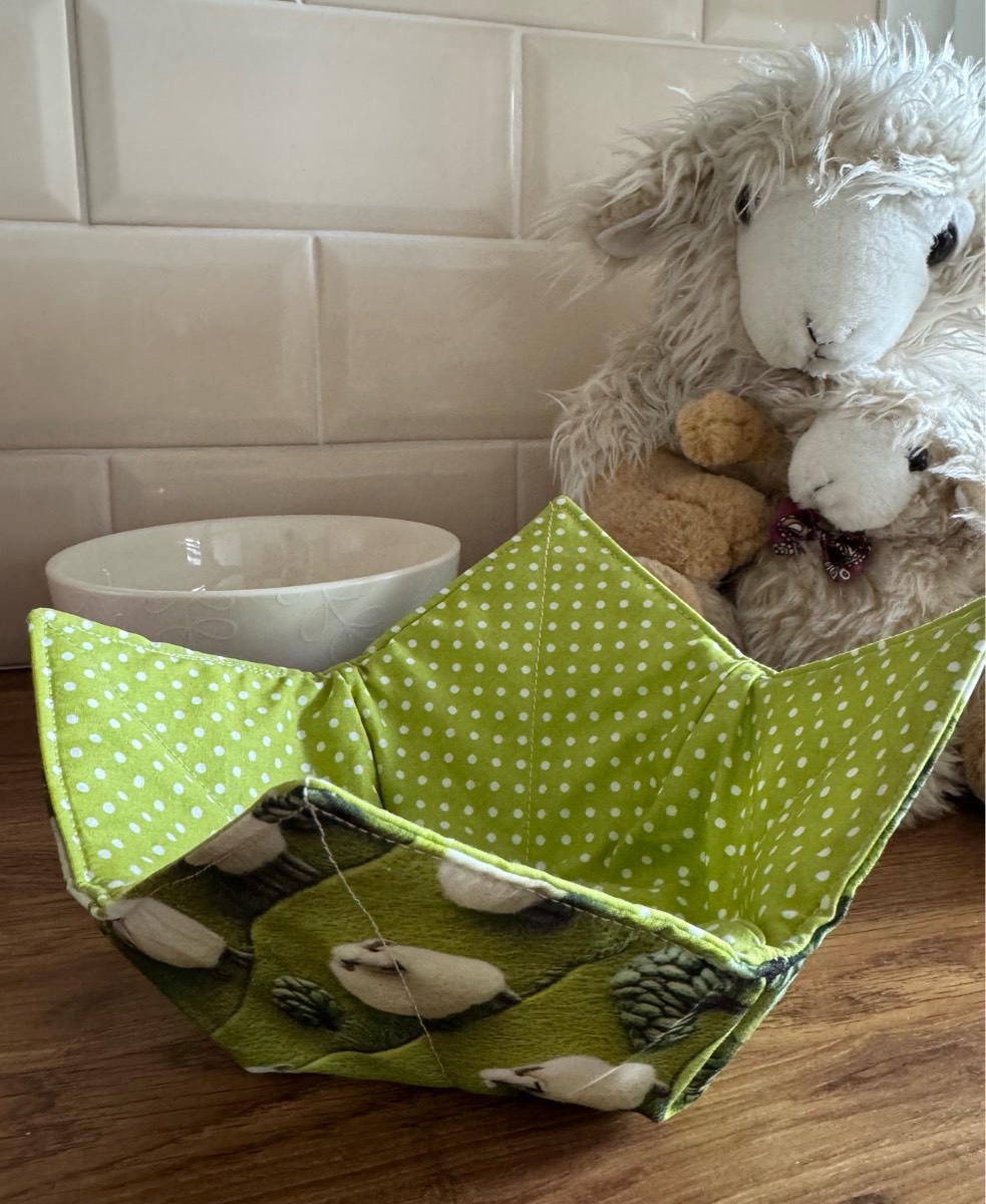 Sheep in field design padded reversible bowl cosy holder