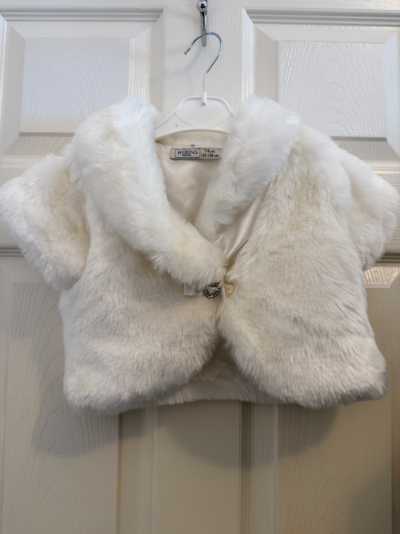 Stunning child’s bolero with a beautiful heart detail
