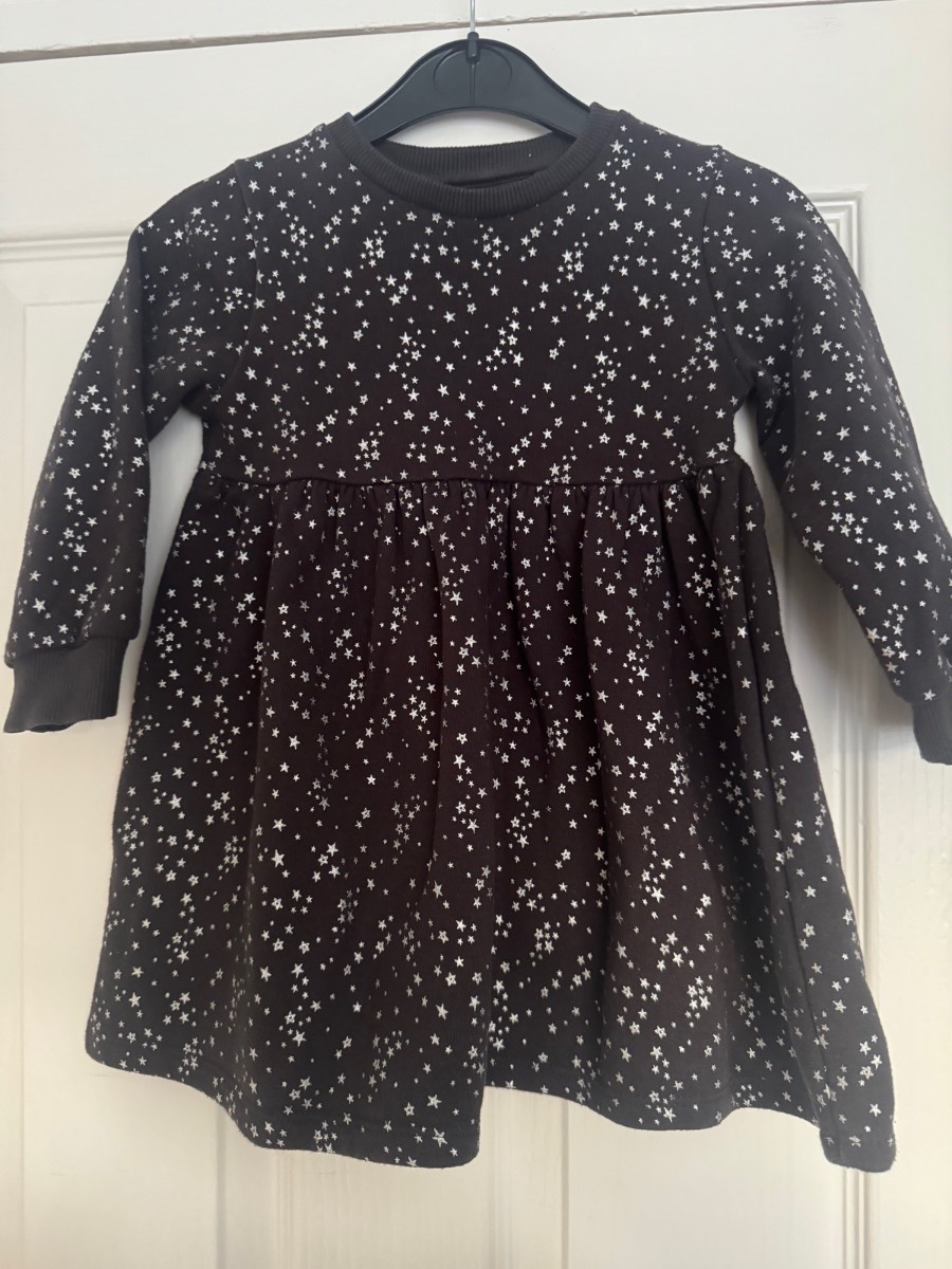 Girls black sparkly star jumper dress