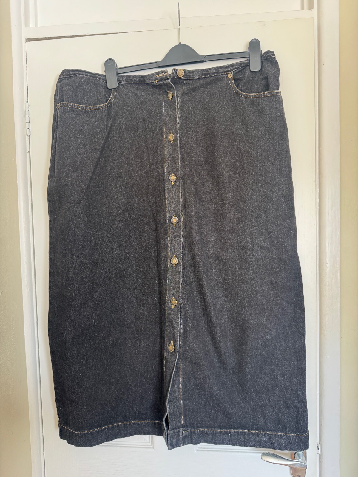 Ladies black button up front denim skirt