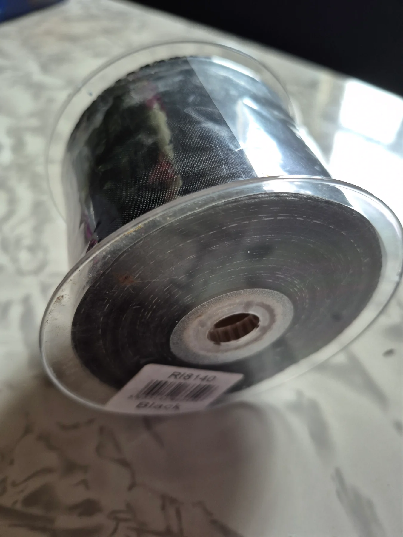 Black ribbon roll