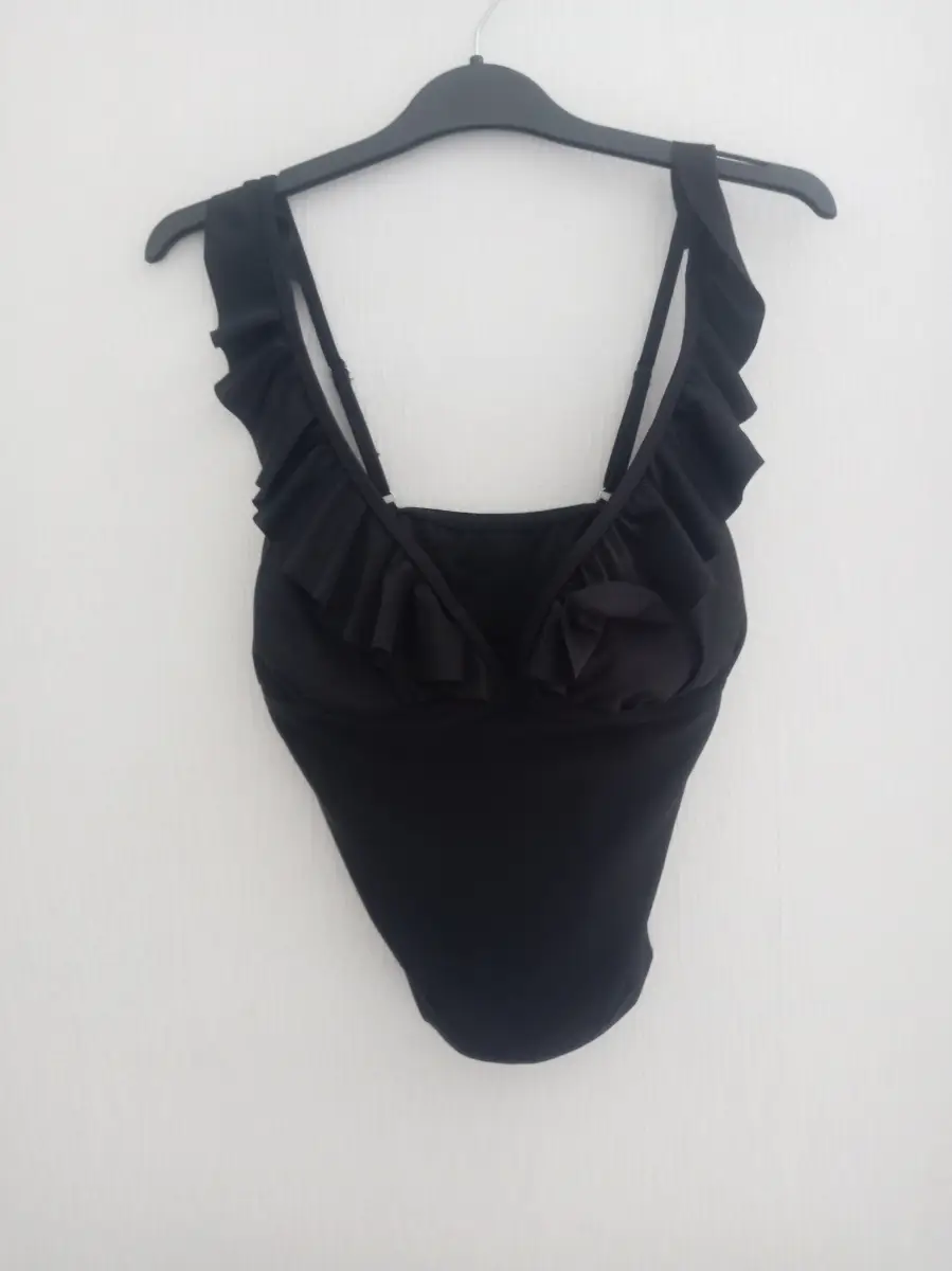 Black swimwear set includes strappy top and skirt with attached underwear size L new without tags