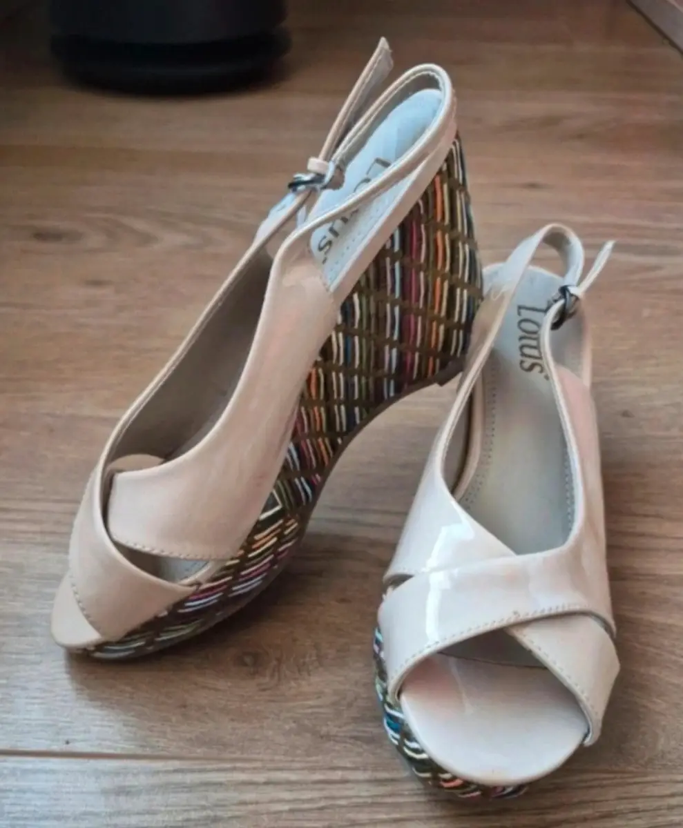 Cream patent wedges with a colourful heel detail. Size 4
