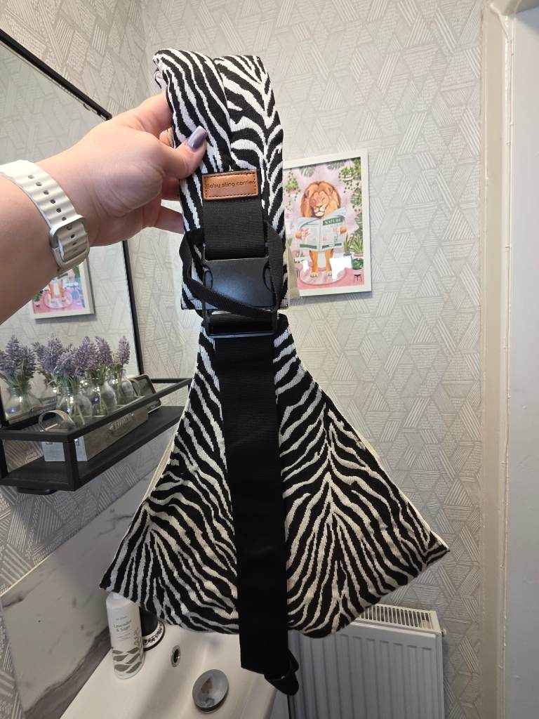 Baby hip carrier in zebra print
