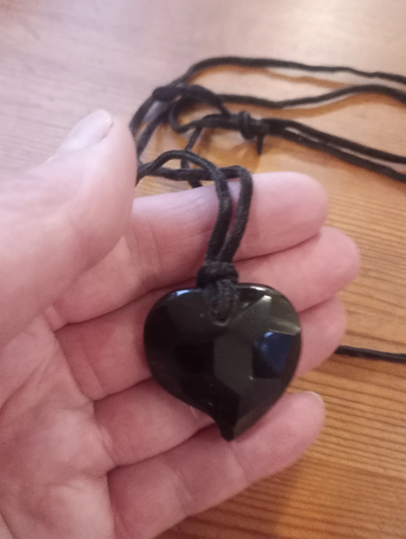 Black glass heart shaped pendant with faux leather thong necklace