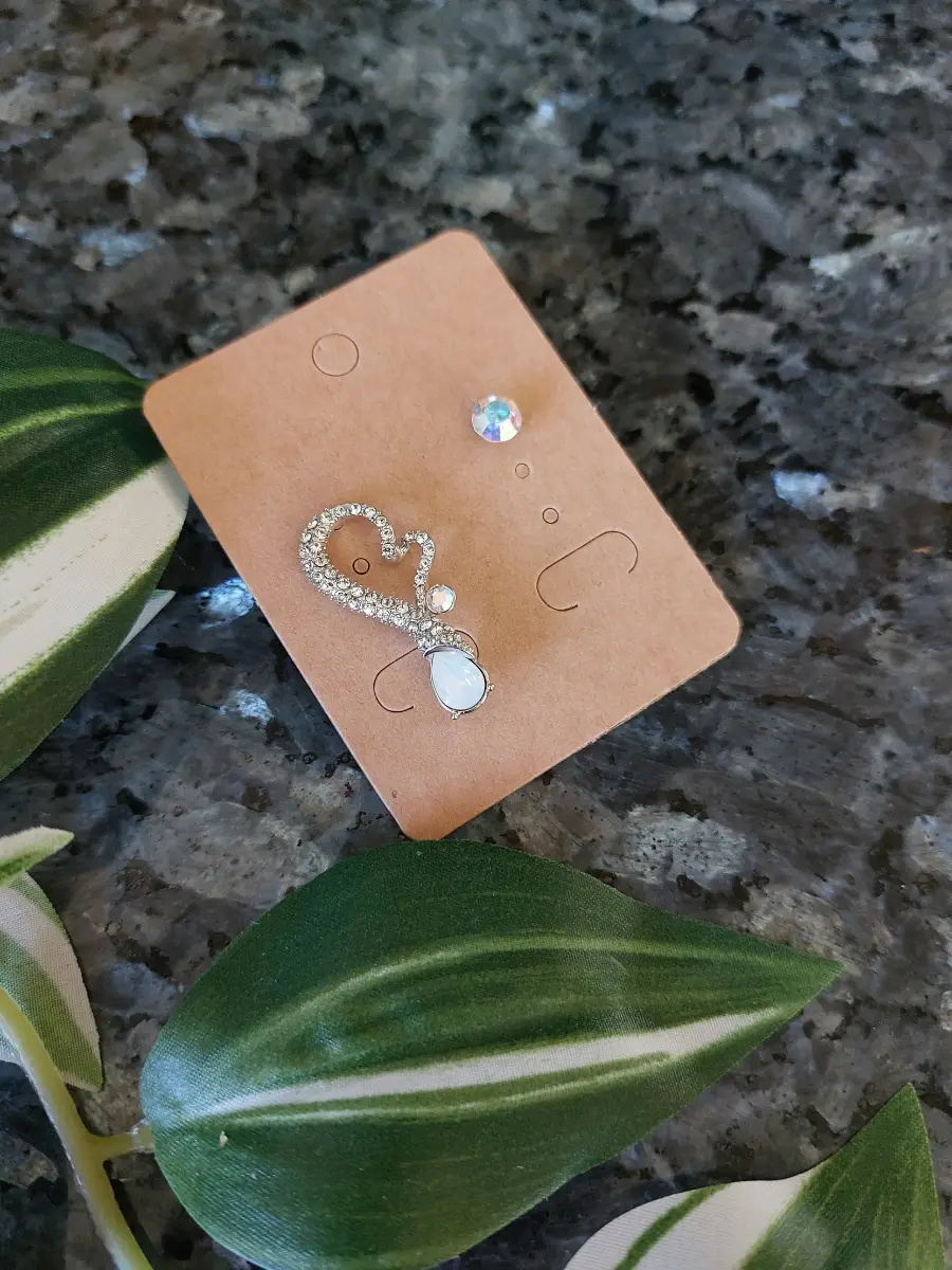 Silver tone vintage statement assymetric mis-matched earrings with crystals.