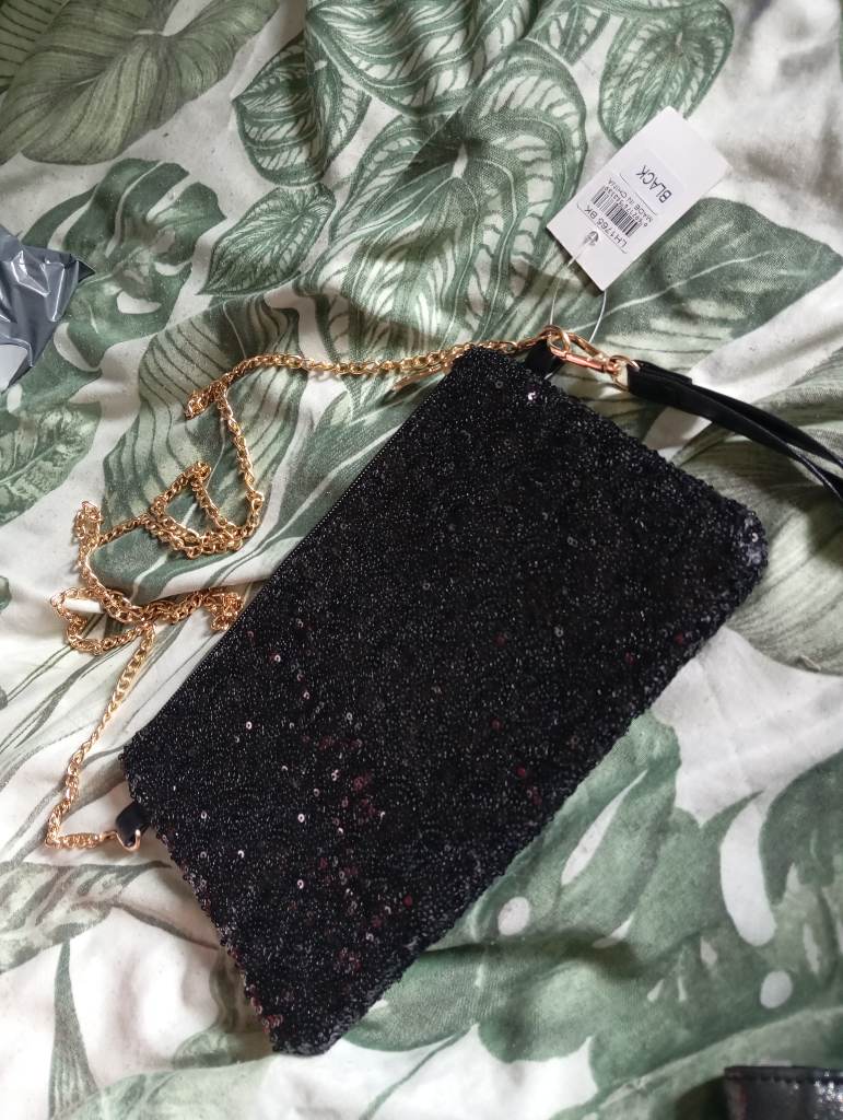 New stunning black sequinned handbag