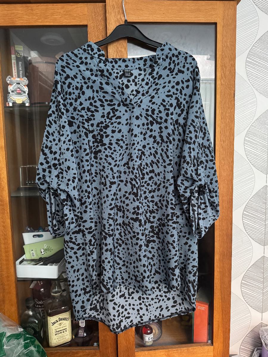 Brand new size XL ladies blue and black animal print long long blouse