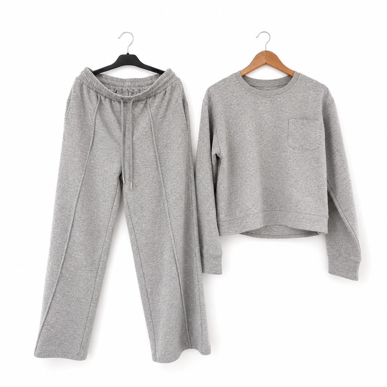 Matching grey loungewear. Crewneck pocket sweatshirt and pintuck wide-leg sweatpants.
