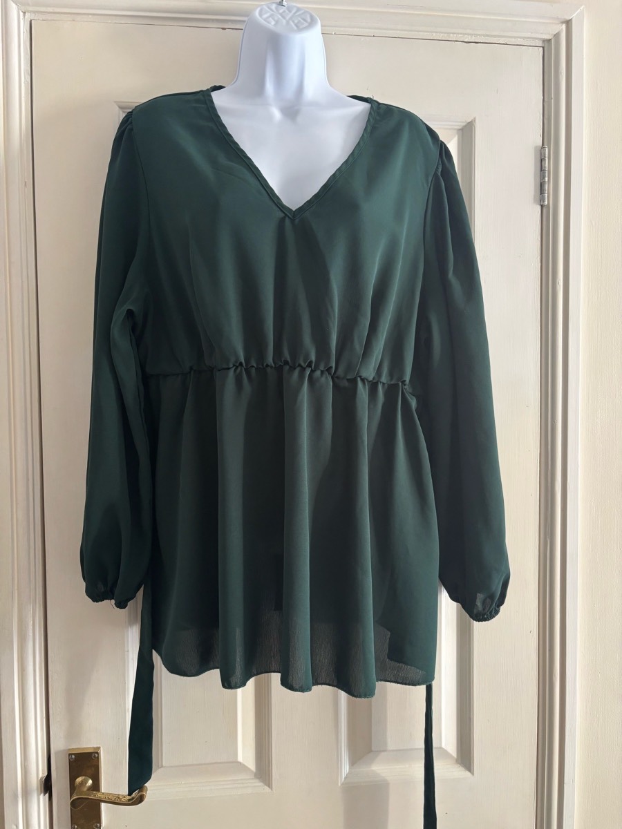 Long sleeved dark green top