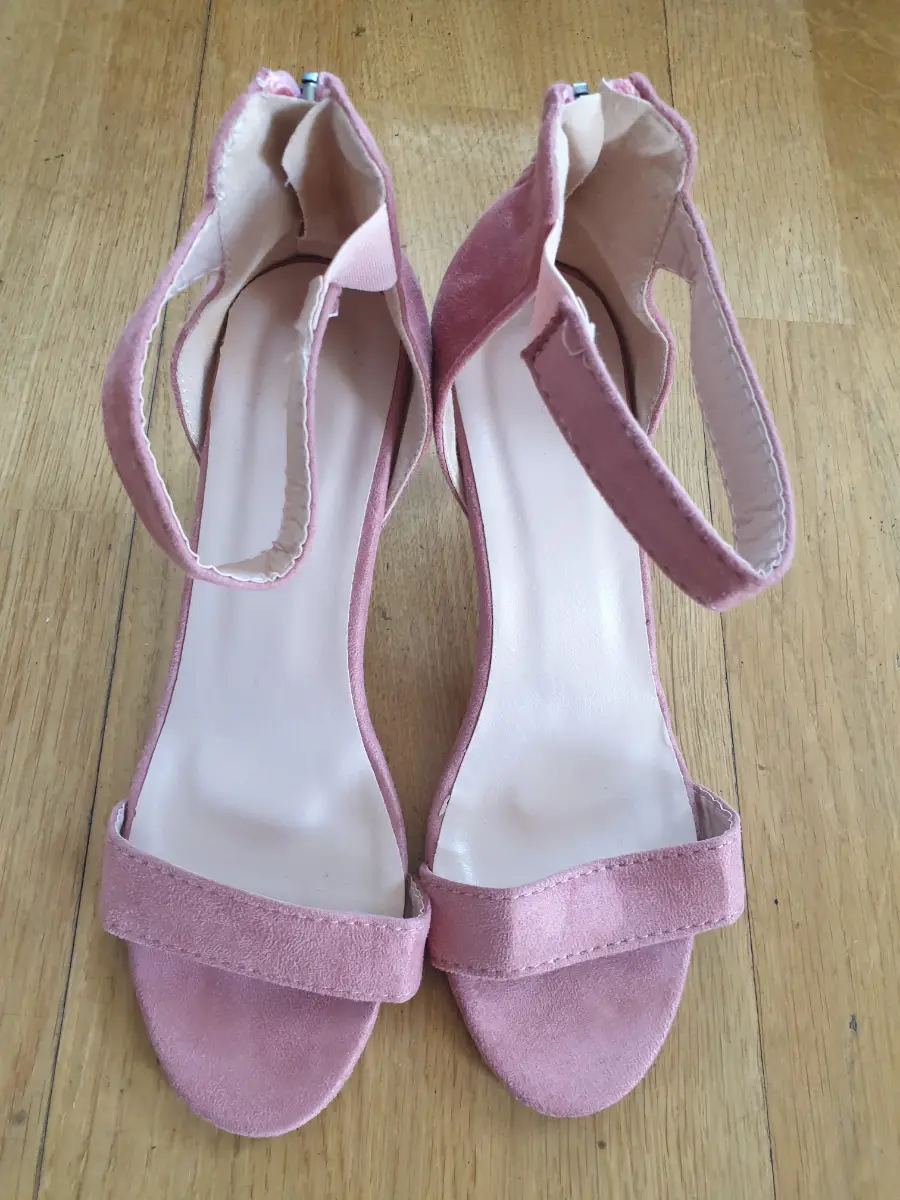 Pink faux suede heels with a 3" heel