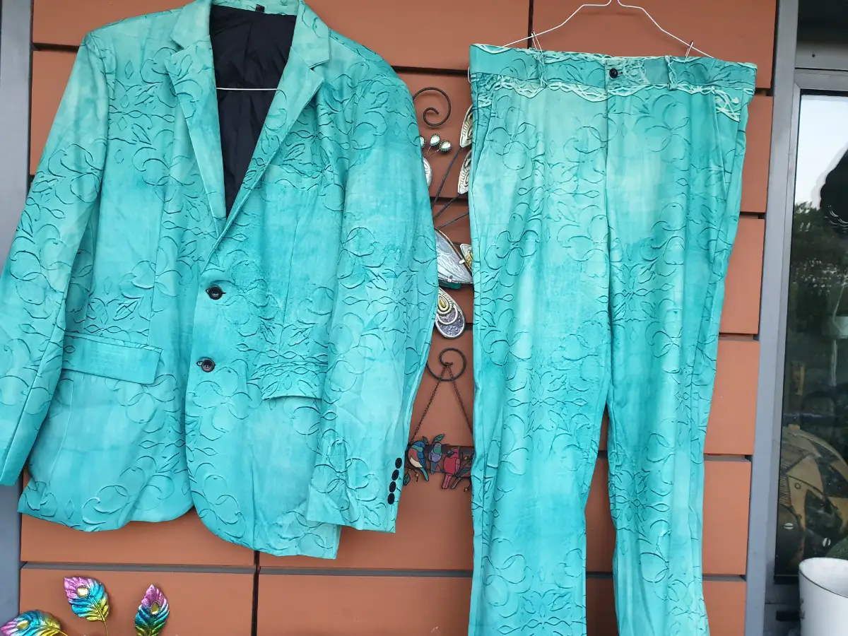 New. Flamboyant men's teal/green suit with floral and vine design.