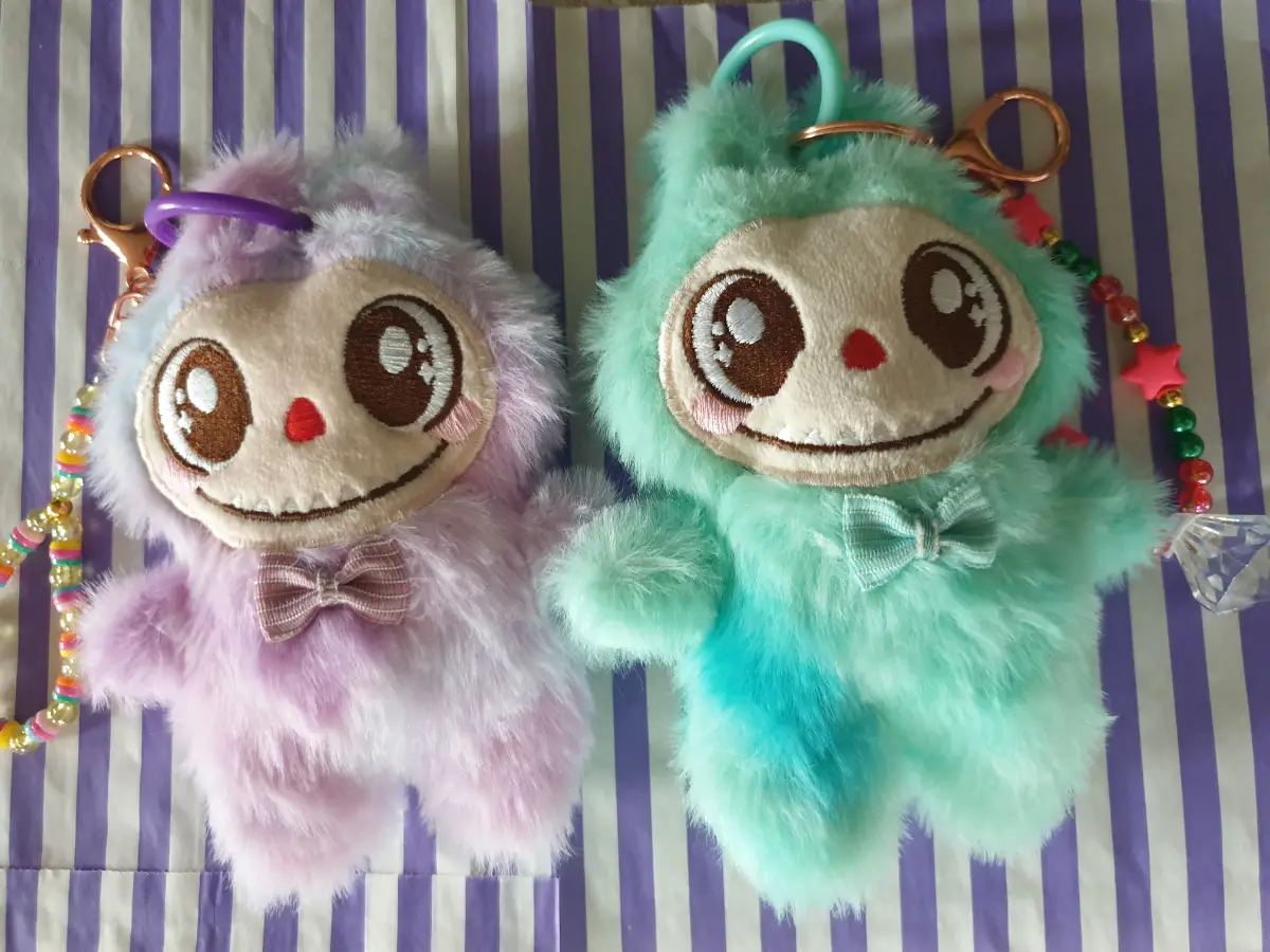 Two furry bag charms