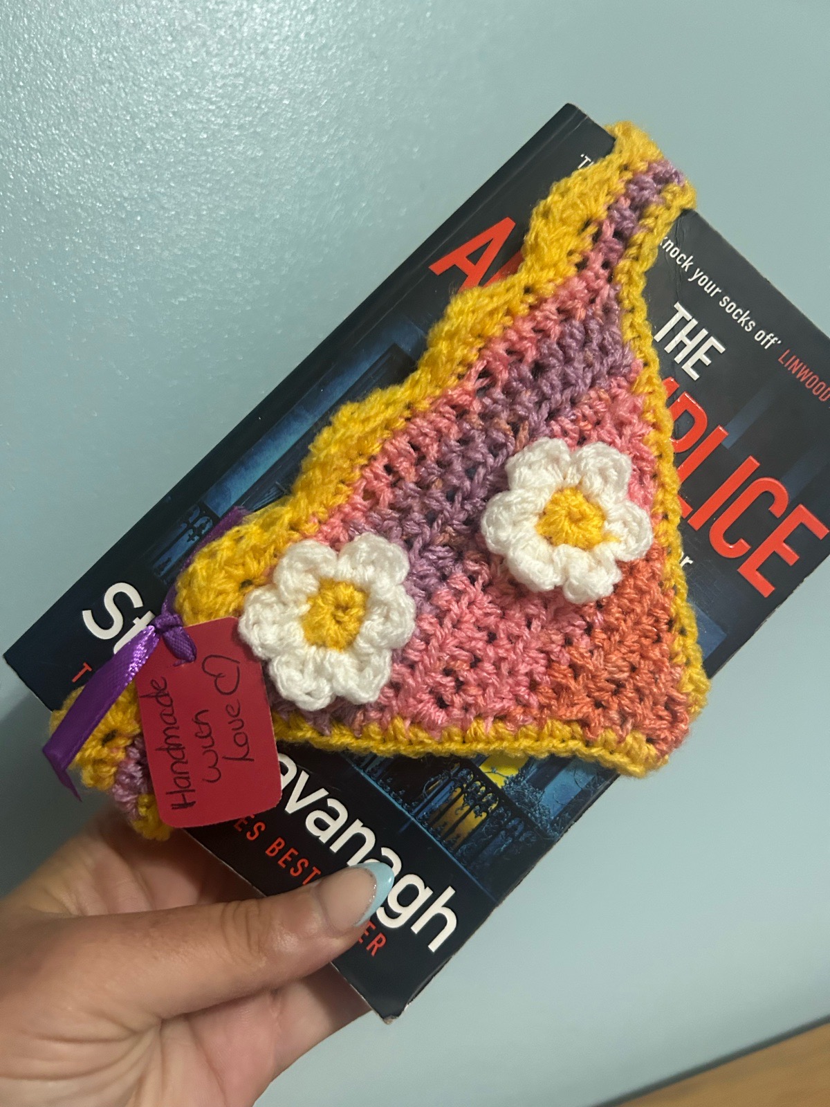 Book bikini book thong book mark. Orange yellow colour daisies.