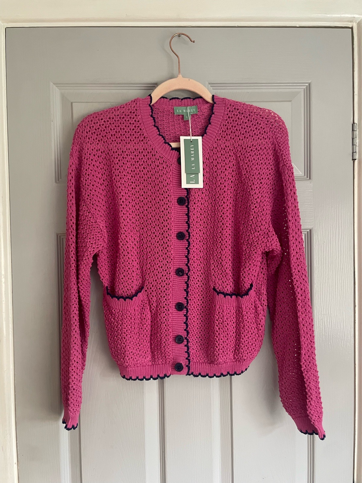 fuchsia pink crochet open-knit cardigan