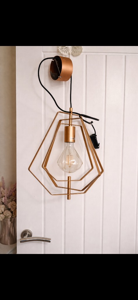 Copper coloured light diamond shaped pendant with bulb