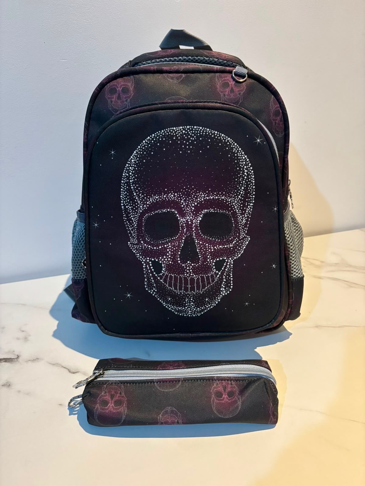 Black skull print backpack & matching pencil case set