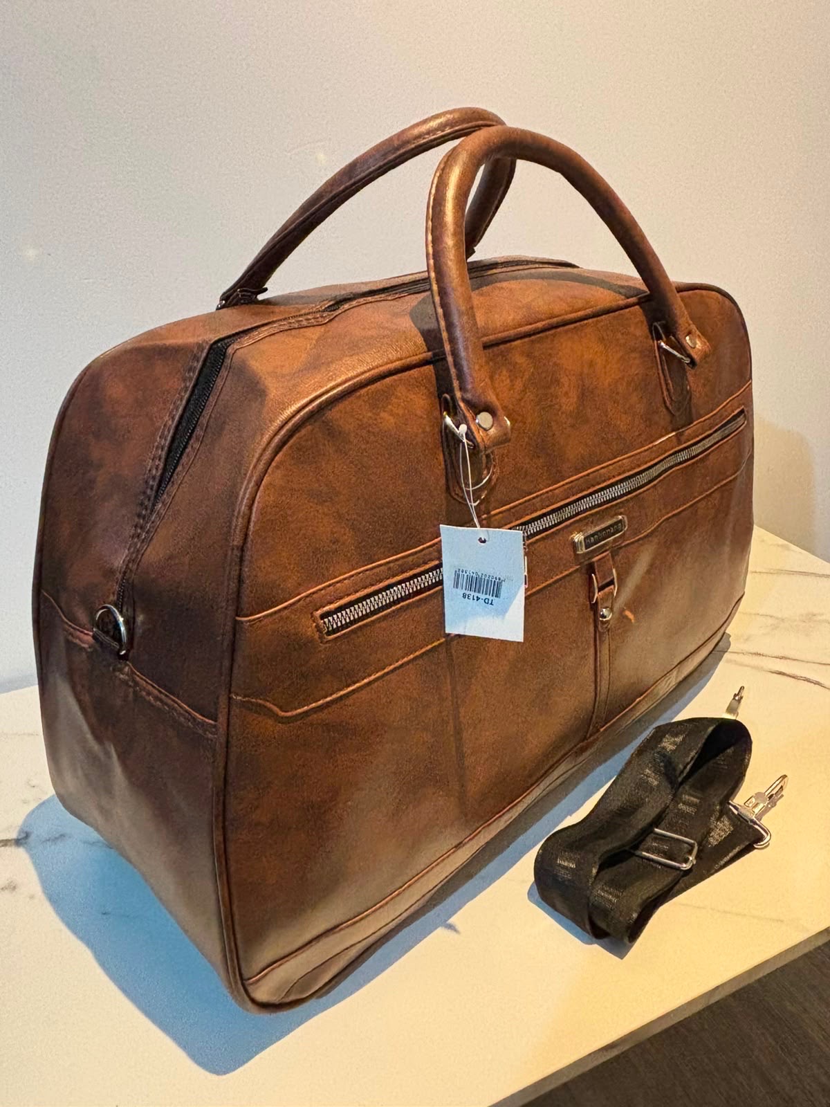 Brown leather - look travel bag with shoulder strap unisex