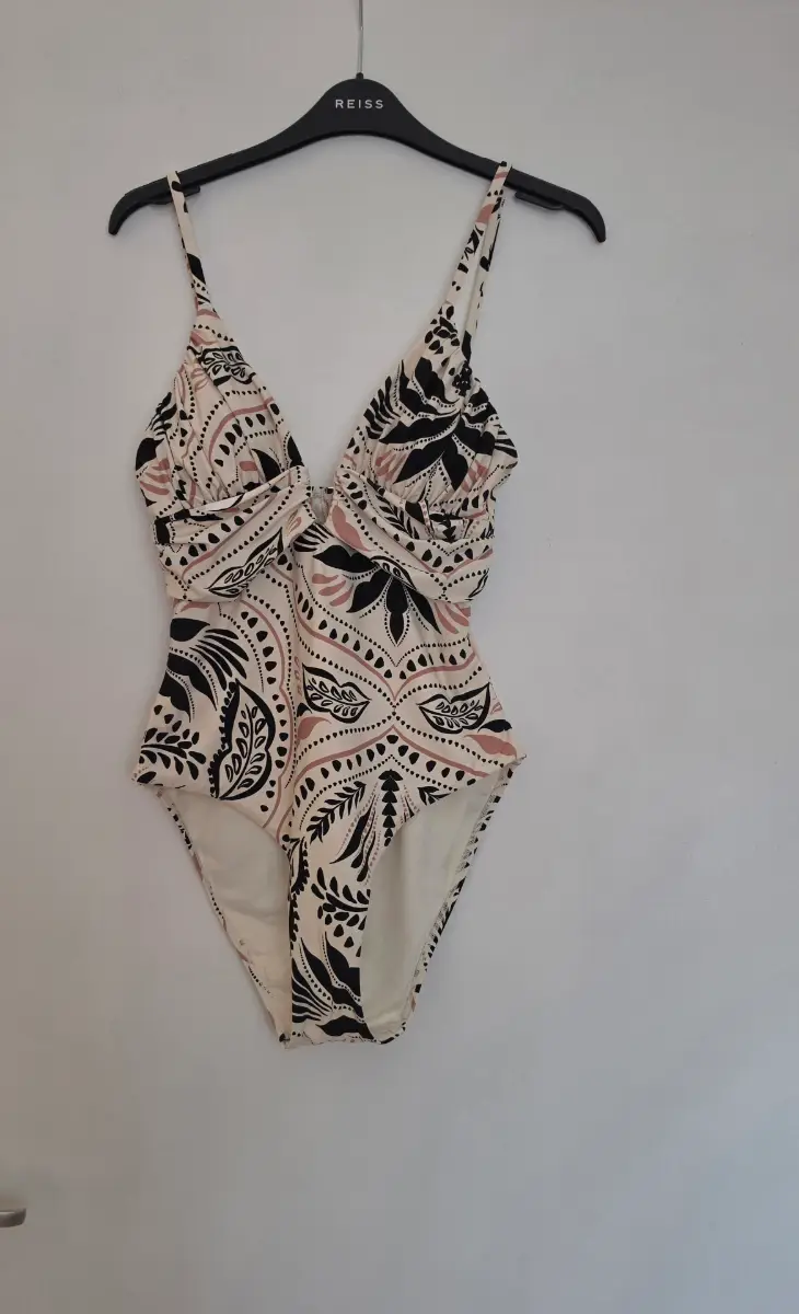 Lightly padded open back swimsuit.