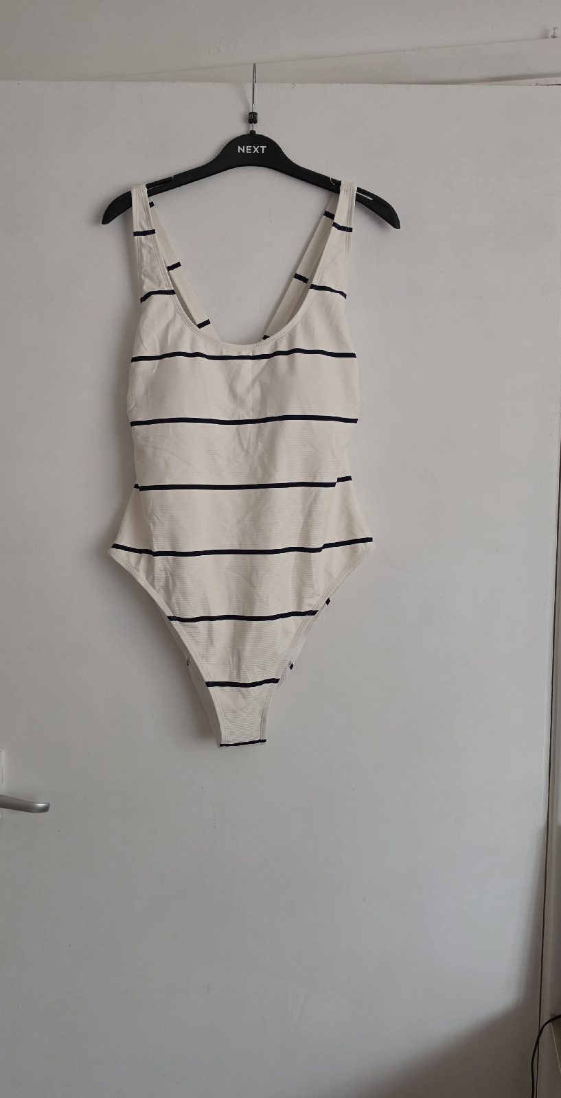 Striped one-piece swimsuit with a ribbed texture and a waist-shaping design.