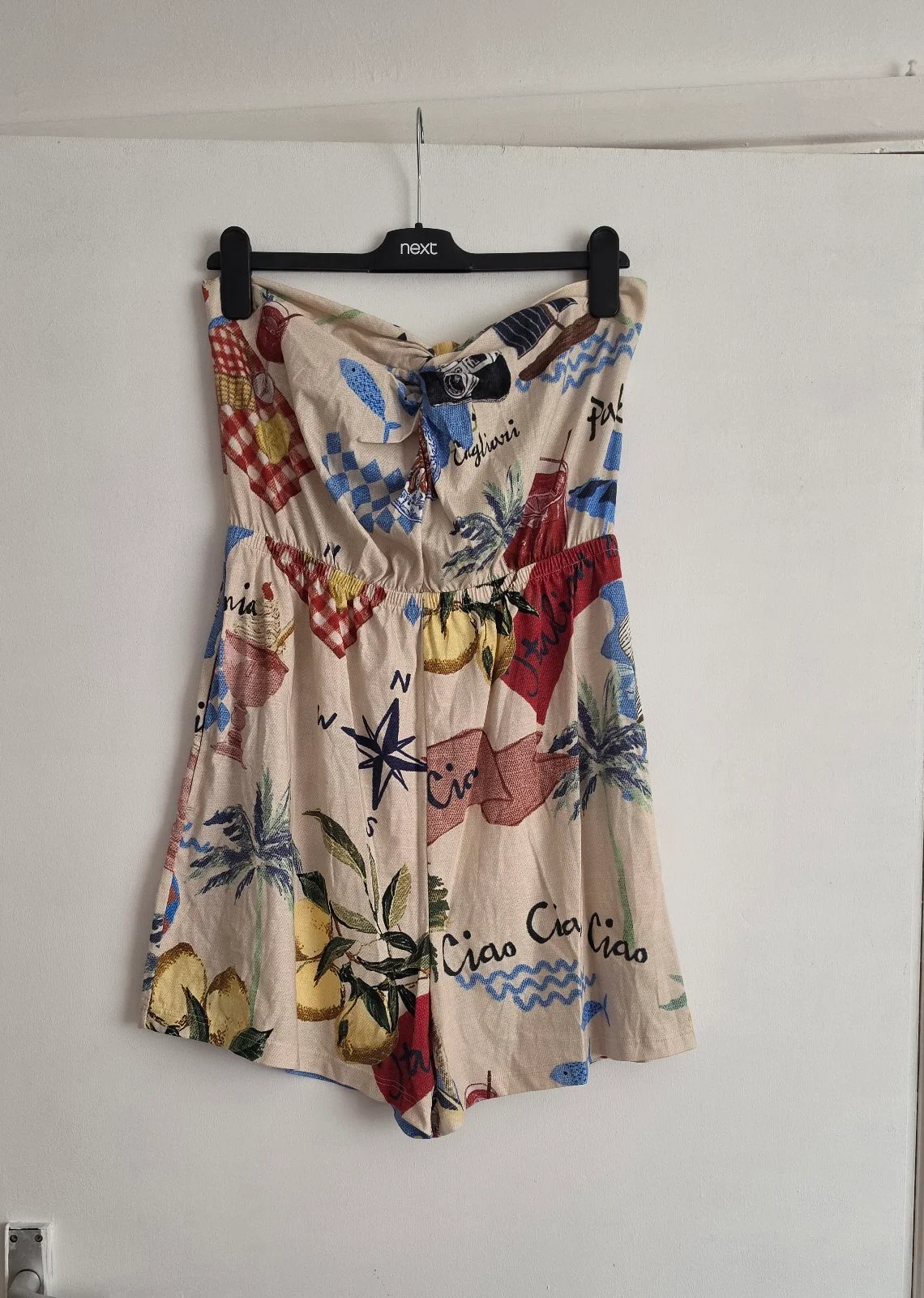 Strapless playsuit featuring Italian motifs and a map print with "Ciao" lettering.