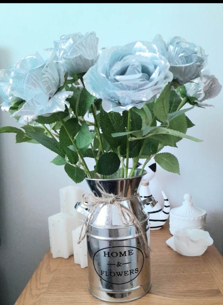 Silver metal milk churn vase with silver artificial flowers