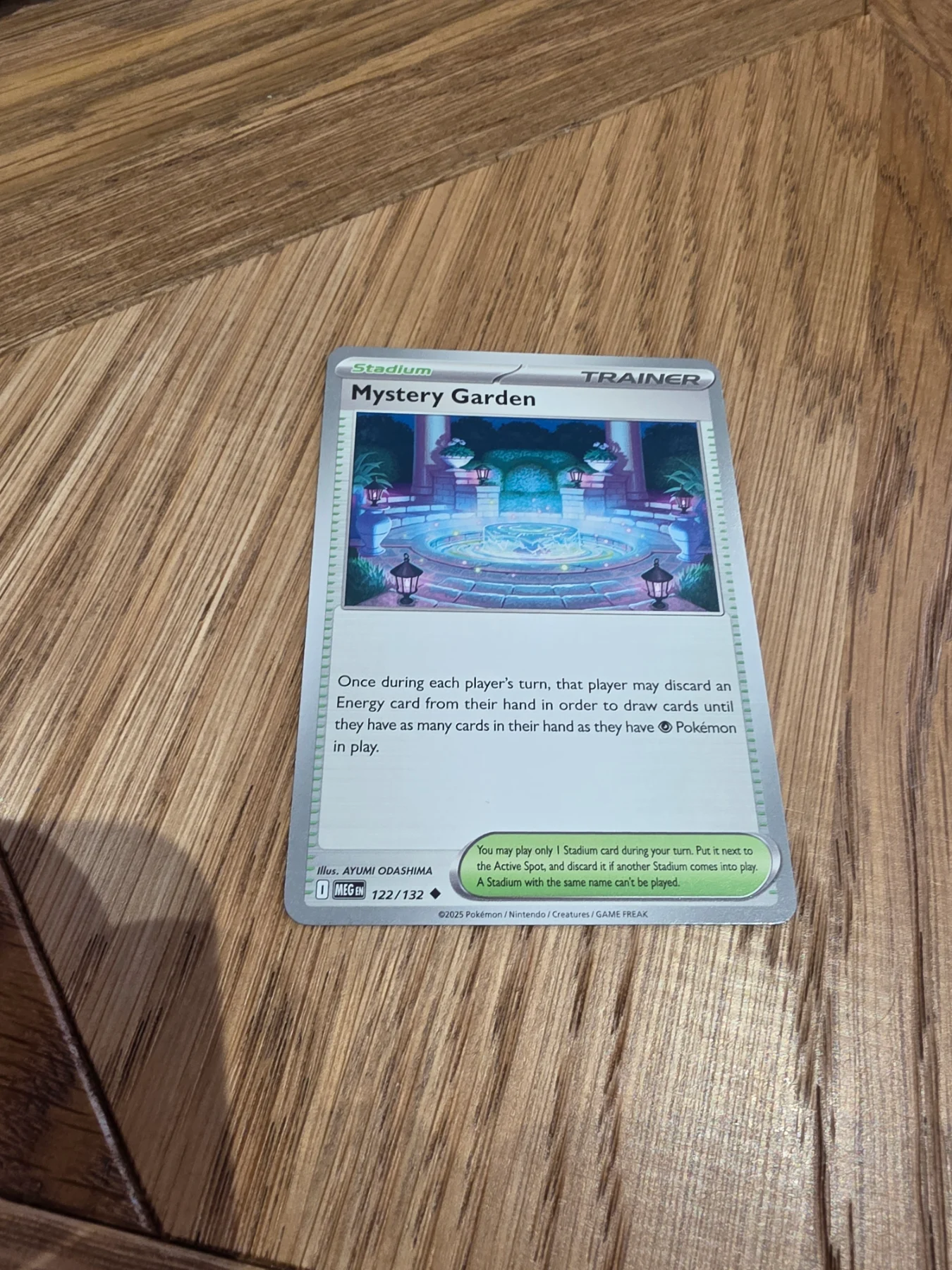 Mystery garden trainer stadium 122/132 mega evolution pokemon card